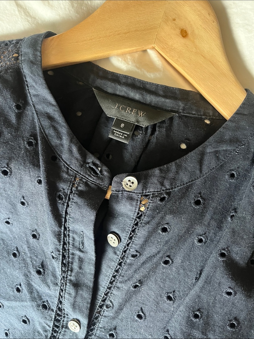 J. Crew navy eyelet blouse with detail at shoulder and hem